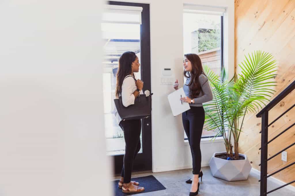 Just inside front door, realtor explains home's features